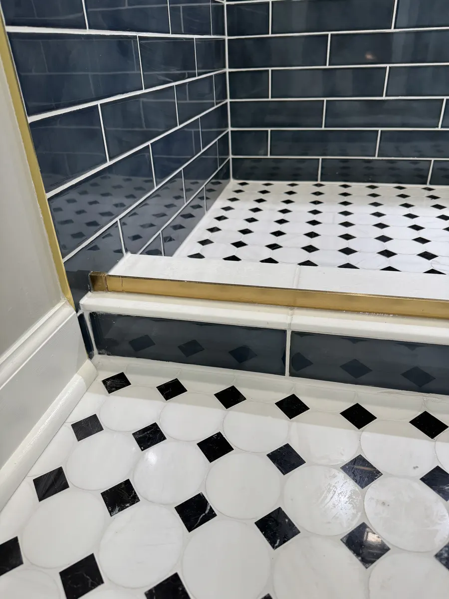 Finished bathroom view with tiled shower