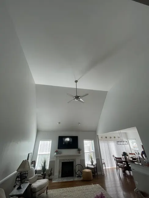 High ceiling crown moulding installed along angled roof transition